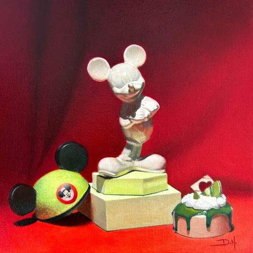 A white mouse statue stands on boxes beside a yellow hat with black ears and a green dessert on a red background, creating an eye-catching scene perfect for e-commerce displays.